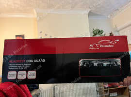 Universal car dog guard attaches to headrests