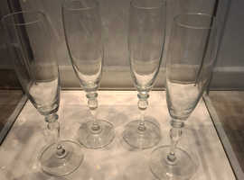 4 champagne glasses never been used