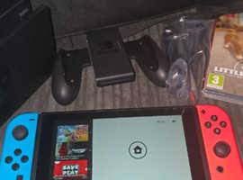 Nintendo switch with accessories, games and bag