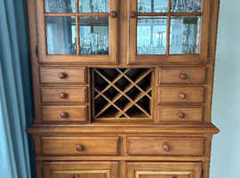 Wooden dresser display/ drinks cabinet with electric lighting.