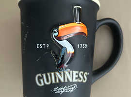 Guinness large embossed black toucan mug
