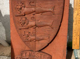 Royal Coat of Arms brick from a demolished building .