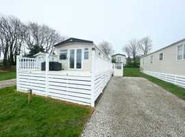 Stunning static caravan for sale with full wrap around decking and lake views in Crantock, Cornwall.