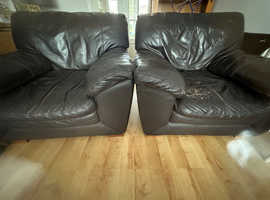 2 dark brown leather chairs