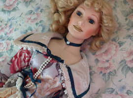 VINTAGE porcelain doll. 24 inch. dressed beautifully.. non smoking home.  display piece.