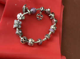 For Sale:; Pandora  Charm Bracelet with 14 charms included.