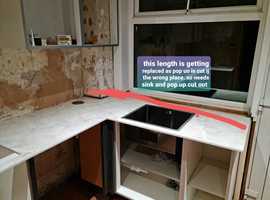 WANTED someone who can fir compact laminate worktops