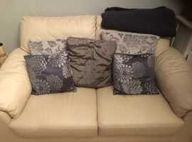 2 leather cream sofas