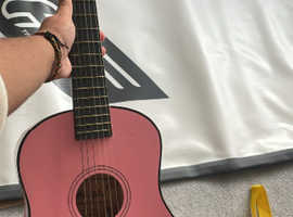 Pink childrens acoustic guitar