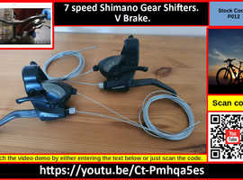 7 speed Shimano Gear Shifters. V Brake.