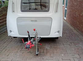 Pop up touring caravan