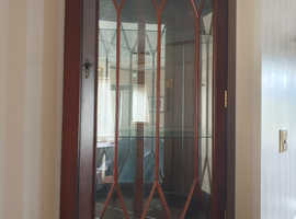 Wall mounted glass fronted mahogany display unit.