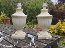 Pair of cream/gold ceramic table lamps.