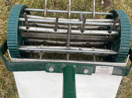 Lawn aerator steel spike roller