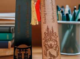 X 2 Wood Bookmarks with detailed engravings of a Japanese Gate and a Wolf, with tassels. PRICE £3.30