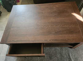 Dark brown oak coffee table with shelf and drawer each side