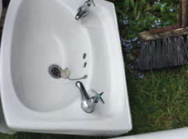 White hand basin on pedestal  and toilet