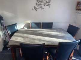 Large marble dinning table and six chairs