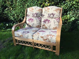 Luxury cane two-seater. Quality upholstery.