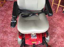 JAZZY PRIDE POWER CHAIR - POWERED HEIGHT ADJUSTABLE SEAT - BRAND NEW BATTERIES (NEVER USED).