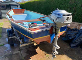 small boat with outboard and trailer for sale