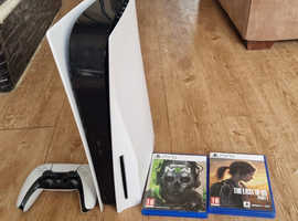 PlayStation 5 with controller and 2 games