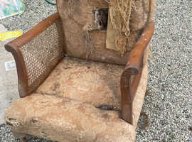 Two solid rattan sided chairs.
