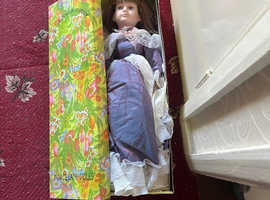 Porcelain dolls in boxes