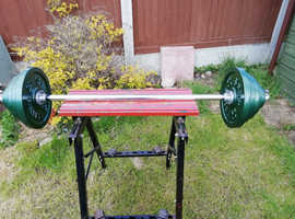 Weightlifting discs , bars, dumbells ,squat stands.