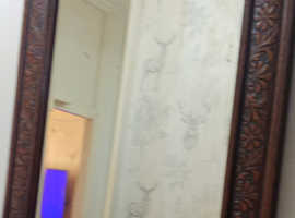 Carved wood framed mirror