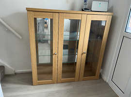 Glass fronted cabinet with lights
