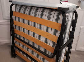Folding bed with mattress