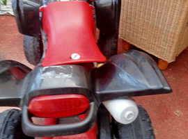 Red kids battery operated quad bike with brand new 6v battery all works