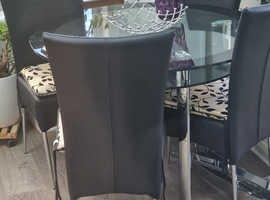 Glass and chrome round dining set