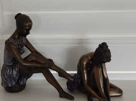 Two Degas style Seated Ballerina figurines