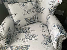 Two retro wingback armchairs
