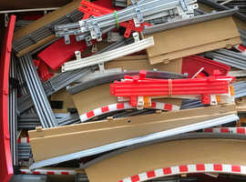 Scalextric box full of barriers and various bits and bobs