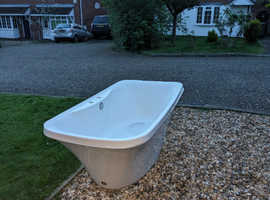 Freestanding double ended bath with cushions