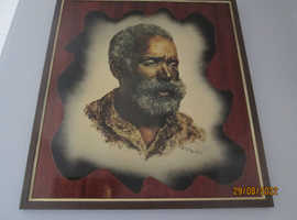 Large painting of a south african man inposed on a teak fram