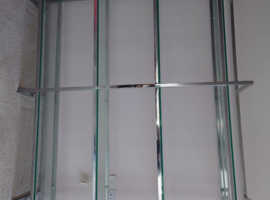 Solid glass and chrome shelving unit