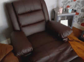 Brown faux leather recliner armchair