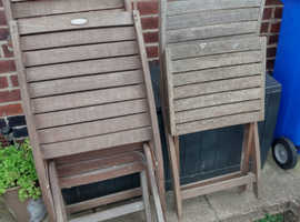 Four solid teak garden chairs in good condition throughout