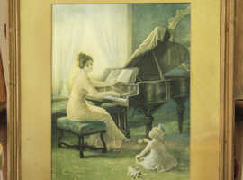 Framed print by Zula Kenyon of lady at piano with child