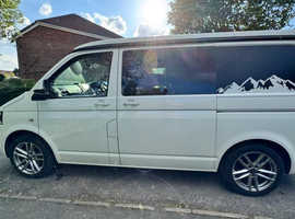 Volkswagen T5 2.0 TDi 102ps manual SWB 4 berth elevating roof in white (3565) It has tinted windows, alloy wheels, barn doors at the rear, single cab