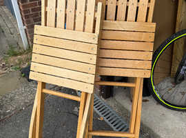 2 foldable wooden chairs