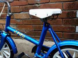 Old vintage push pipin bike for children
