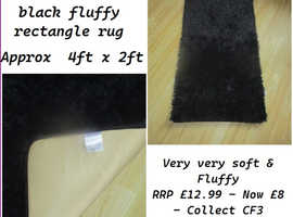 Brand New small black fluffy rug
