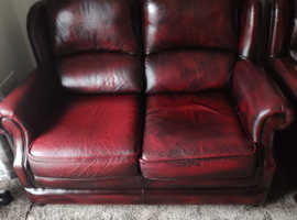 2 settees  2 seater ,antique red leather by Thomas lloyd