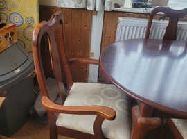 Extending dining table and 6 chairs