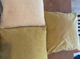 Selection of grey and mustard / ochre cushions with a table runner